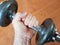 Workout human hand strong lifting arm heavy weight closeup equipment