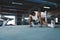 Workout. Man Stretching On Boxing Ring At Gym. Asian Sportsman Warming Up Before Intense Training.