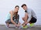 Workout partners and friends. a young couple tying their shoelaces before a workout.