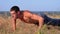 Workout. pushups fitness man doing push-ups outside on nature.