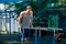 Workout, sportsman pull ups on the horizontal bar