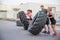 Workout team flipping tires outdoor