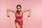 Workout. Woman Training With Resistance Bands On Pink Background