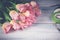 Workplace florist. Graceful tulips on horizontal wooden background