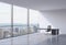 A workplace in a modern corner panoramic office in New York, Manhattan. A black leather chair and a black table.