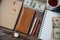 Workplace with money, stylish leather wallet, business things, pen, notebook on wooden table