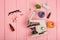 Workplace scientist doctor - microscope, pills, syringe, eyeglasses, chemical flasks with liquid on pink wooden table