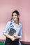 Workplace women in a cafe. portrait of a young fresh brunette with a tablet in hand