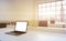 Workplaces in a bright modern loft open space office. Tables equipped with laptops, white copy space in the screen. Docs shelves.