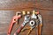 Workshop bench. Variety of hand tools on a wooden table, top view, copy space