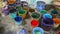 Workshop - a lot of buckets with multi-colored paint. Multi-colors Paint for textile dyeing