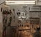 Workshop scene. Image of old tools hanging on wall in workshop. Vintage retro garage style