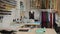 Workshop of tailor studio, tailoring wear to order. interior of small fashion studio. View of rolls of fabric, spools of thread an