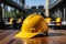 Worksite readiness Construction workers yellow helmet presented on a table