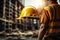 Worksite readiness Engineer wears yellow safety helmet on construction site