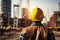 Worksite readiness Engineer wears yellow safety helmet on construction site