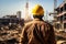 Worksite readiness Engineer wears yellow safety helmet on construction site