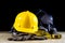 Workwear, helmet, gloves and glasses on a wooden working table.