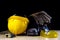 Workwear, helmet, gloves and glasses on a wooden working table.