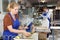 Workwoman cleaning glass