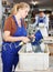 Workwoman cleaning glass