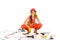 workwoman in overalls sitting on floor with different equipment and tools,