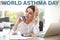 World asthma day. Young woman using inhaler in office