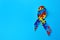 World Autism Awareness Day. Colorful puzzle ribbon on turquoise background, top view with space for text