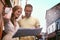 The world is a book with every page worth reading. a happy young couple reading a map while exploring a foreign city