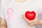 World Breast Cancer Day Concept,health care - woman wore pink t-shirt with Pink ribbon for awareness, symbolic bow color raising