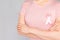 World Breast Cancer Day Concept,health care - woman wore pink t-shirt with Pink ribbon for awareness, symbolic bow color raising