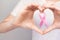 World Breast Cancer Day Concept,health care - woman wore pink t-shirt,Pink ribbon for breast cancer awareness, symbolic bow color