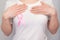 World Breast Cancer Day Concept,health care - woman wore white t-shirt,Pink ribbon for breast cancer awareness, symbolic bow color
