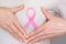 World Breast Cancer Day Concept,health care - woman wore white t-shirt,Pink ribbon for breast cancer awareness, symbolic bow color