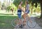 The world is brighter when theyre together. A young couple in love on a vintage bike in the park.