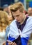 World cup 2018. Moscow FIFA 2018. Emotions of football fans on Moscow streets. A young man wearing Russian flag with telephone.