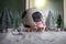 World cup at wintertime concept. Football Soccer ball on snowy decorated table with toy miniatures. New Year Christmas theme.