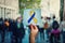 World Down Syndrome day as hand holding a paper sheet with blue yellow awareness ribbon symbol over crowded street background