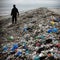 World Earth Day a single person cleaning up a polluted beach