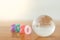 World Economy and 2020 business planning concept. Close up of glass mini world ball with colorful wooden number on wood table with