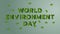 World Environment day concept. Earth Day. Cut shape of lettering for leaves decorate on pastel green solid color background.