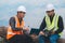 World environment day concept ,Thai Asian Female engineering working with a tablet laptop at sewage treatment plant