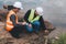 World environment day concept ,Thai Asian Female engineering working with a tablet laptop at sewage treatment plant