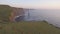 World famous birds eye aerial drone view of the Cliffs of Moher in County Clare, Ireland.