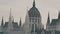 The world-famous building of the Hungarian Parliament in Budapest in the Gothic style in cloudy weather.