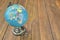 World Geographical Globe On The Wooden Table