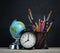 World Globe, School Stationary and Alarm Clock on Blackboard