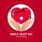 World heart day banner with hand hold care stethoscope around red heart sign in circle on red background vector design