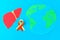 World Hepatitis Day. June 28th. Red yellow ribbon, planet earth and liver on a blue table.