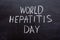 World Hepatitis day text on a chalkboard